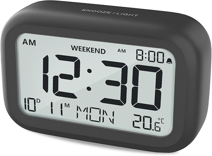 DOOMAY Digital Alarm Clock Bedside - Battery Powered Clock with LCD Display Volume Adjustable Snooze and Weekend Mode for Bedroom Office Desk Travel (Black)