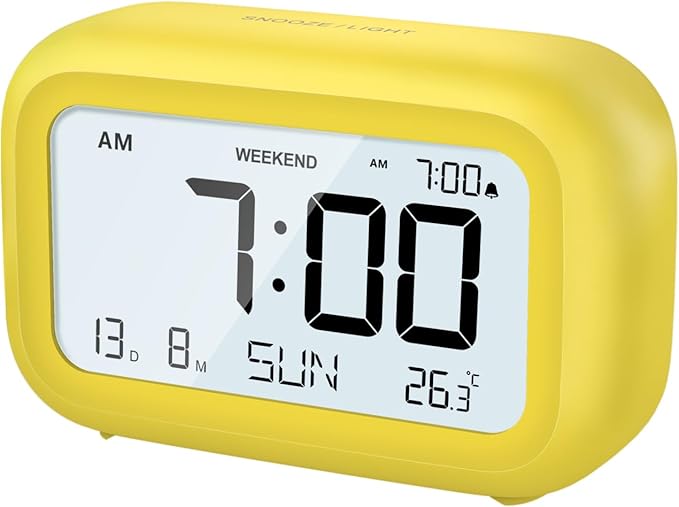 DOOMAY Digital Alarm Clock Bedside - Battery Powered Clock with LCD Display Volume Adjustable Snooze and Weekend Mode for Bedroom Office Desk Travel (Yellow)